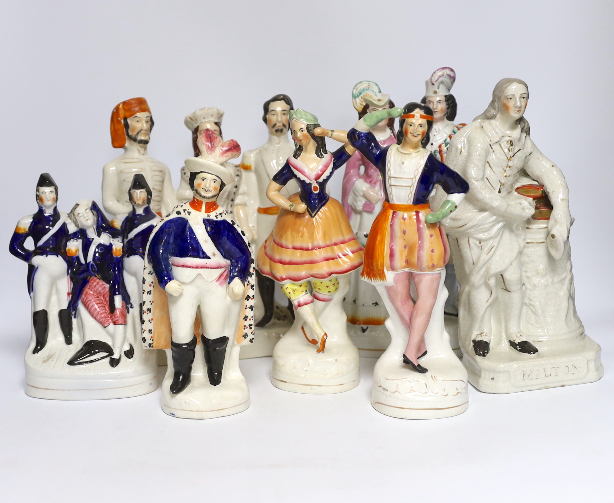 Seven 19th century Staffordshire flat back figure groups, including figures of Milton, Nelson, a pair of dancers, etc., tallest 29cm